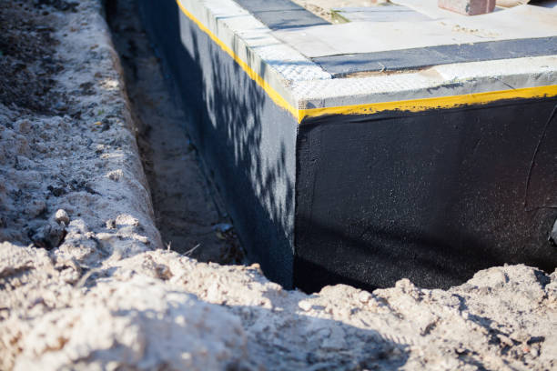 Professional Waterproofing technician working in Jackson Center, OH